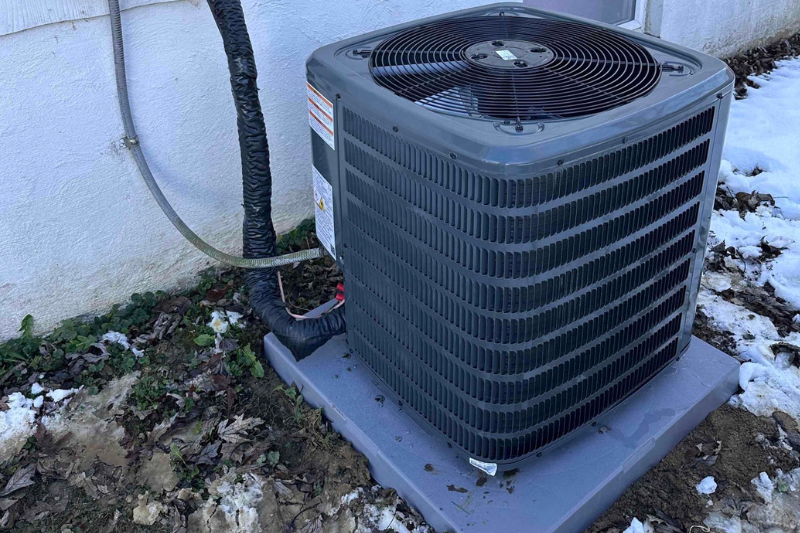 Photo of an outside HVAC unit for December service call tips.